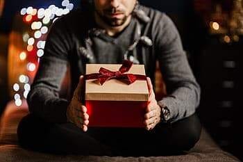 man holding present